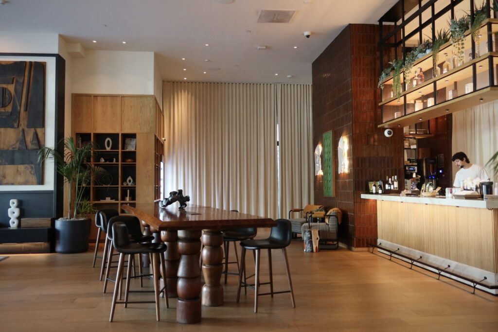 Stylish renovated common area with modern bar seating and warm design, enhancing rental property appeal.