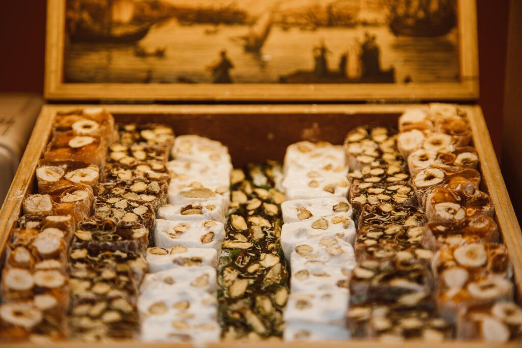 Traditional Spanish Christmas nougat turrón with almonds displayed at a market in Valencia