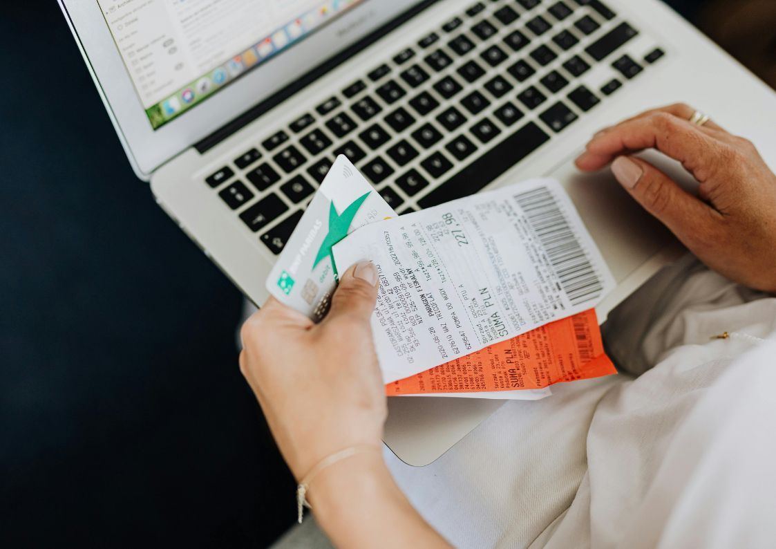 Person reviewing receipts and online purchases during Black Friday on a laptop.
