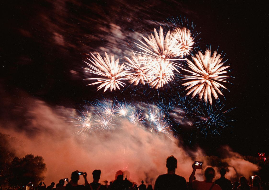 Fireworks illuminating the night sky in Spain, symbolizing celebrations leading up to the holiday season.