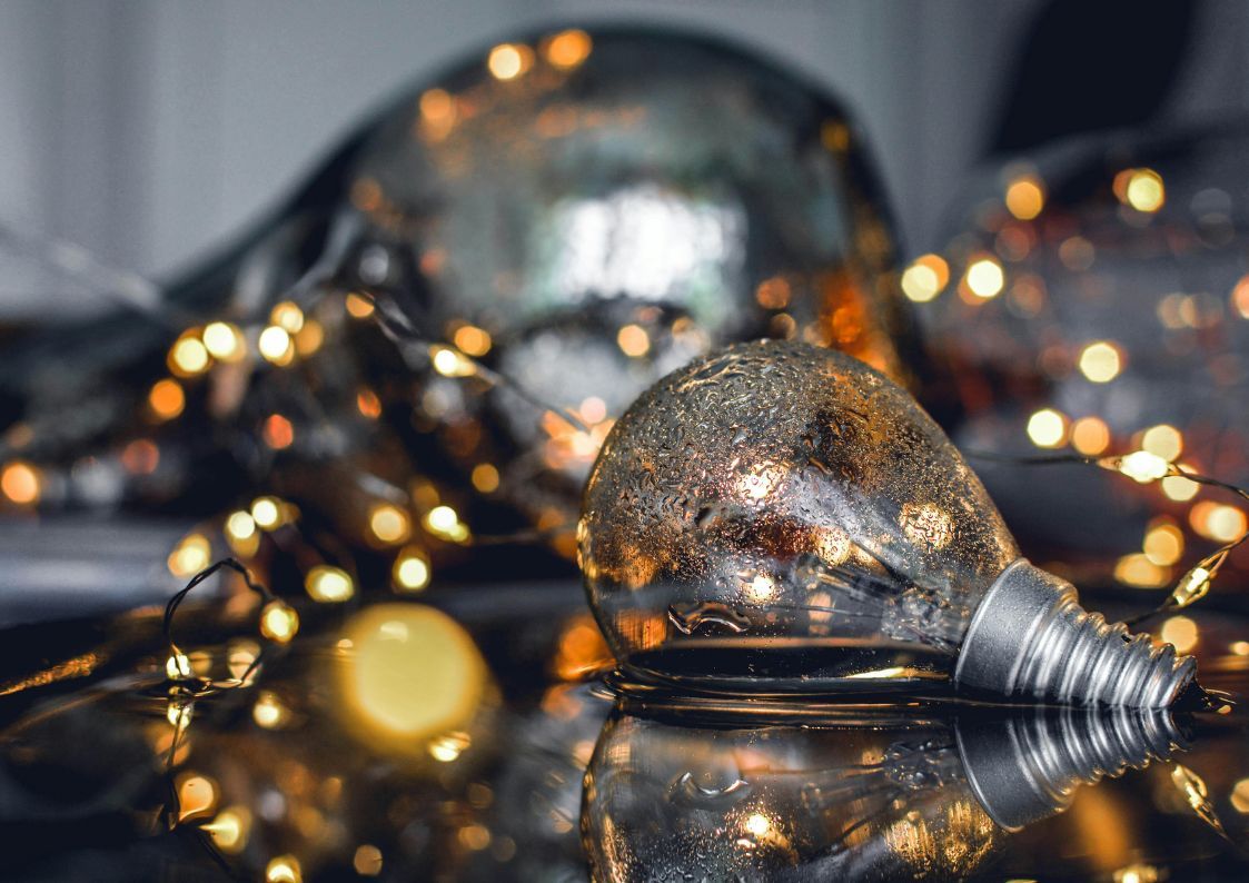 Festive winter lights and glass ornaments creating a warm, cozy atmosphere indoors