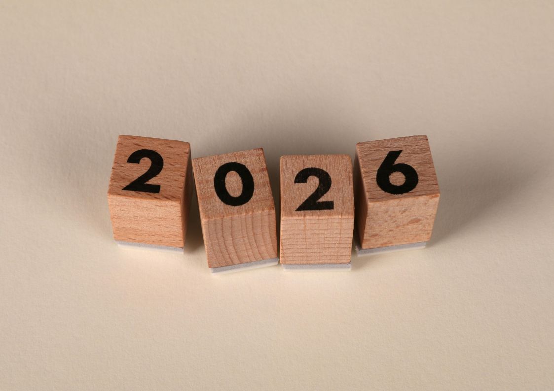 Wooden blocks arranged to display the year 2026.